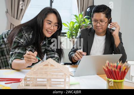 Architects women and engineer working on construction site. Stock Photo