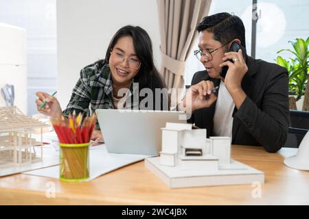 Architects and owner working on construction site. Stock Photo
