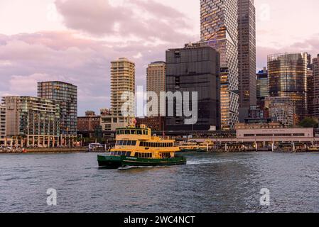 Sydney Harbour Ferry leaves Circular Quay at sunset, Sydney, New South Wales, Australia Stock Photo