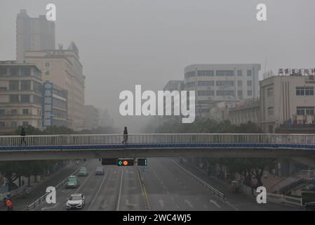 FUYANG, CHINA - JANUARY 14, 2024 - The urban area is shrouded in smog in Fuyang city, Anhui province, China, January 14, 2024. Stock Photo