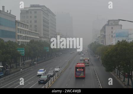 FUYANG, CHINA - JANUARY 14, 2024 - The urban area is shrouded in smog in Fuyang city, Anhui province, China, January 14, 2024. Stock Photo