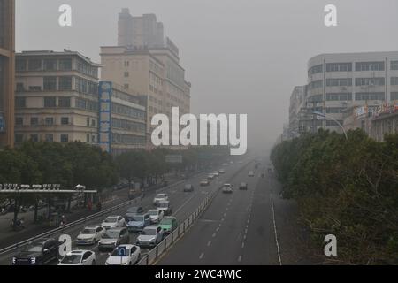 FUYANG, CHINA - JANUARY 14, 2024 - The urban area is shrouded in smog in Fuyang city, Anhui province, China, January 14, 2024. Stock Photo