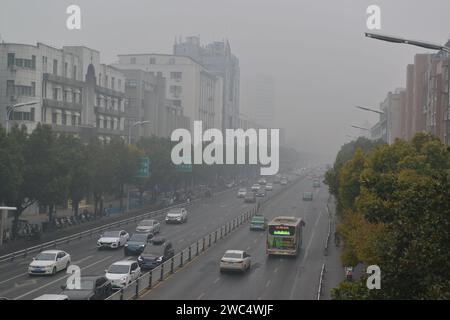 FUYANG, CHINA - JANUARY 14, 2024 - The urban area is shrouded in smog in Fuyang city, Anhui province, China, January 14, 2024. Stock Photo