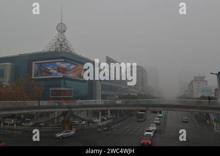 FUYANG, CHINA - JANUARY 14, 2024 - The urban area is shrouded in smog in Fuyang city, Anhui province, China, January 14, 2024. Stock Photo