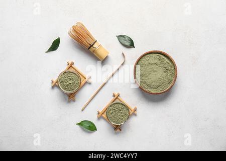 Composition with powdered matcha tea and accessories on light background Stock Photo