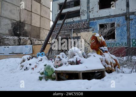 A spontaneous memorial with children's toys covered with snow dedicated to the victims of the Russian rocket attack seen by the apartment building that was heavily damaged by the Russian shelling in Zaporizhzhia. The Ukrainian president Volodymyr Zelenskiy said he was more positive now than he was last month that his country would secure new financial aid from the US. But there was no indication in Washington that congressional approval for an aid package proposed by the White House would be forthcoming anytime soon. Stock Photo