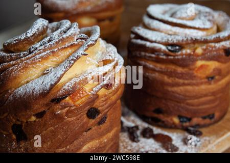 Happy easter. Traditional Easter cakes , homemade kraffins with raisins,candied fruits. Selective focus. Close up of homemade Cruffin. Wooden backgrou Stock Photo