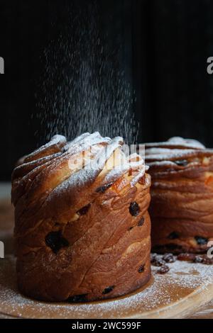 Happy easter. Traditional Easter cakes , homemade kraffins with raisins,candied fruits. Selective focus. Close up of homemade Cruffin. Black backgroun Stock Photo
