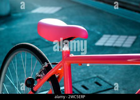 Pink bicycle saddle close up and focused Stock Photo