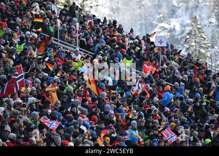 Ruhpolding, Germany. 14th Jan, 2024. Biathlon: World Cup, 10 km pursuit, women. The stands in the Chiemgau Arena are packed with spectators. Credit: Sven Hoppe/dpa/Alamy Live News Stock Photo