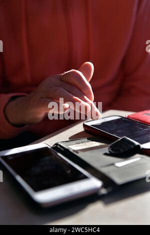 womans hand on mobile phone Stock Photo