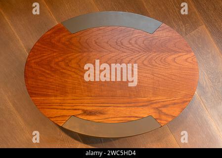 Oval wooden table in top view on wooden palette. background texture Stock Photo