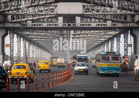 Traffic on the iconic Howrah Bridge, the busiest cantilever bridge in ...