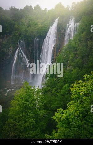 One of the most famous and visited National Park in Croatia, with beautiful ample waterfalls in the misty green forest. Plitvice lakes at rainy day, C Stock Photo