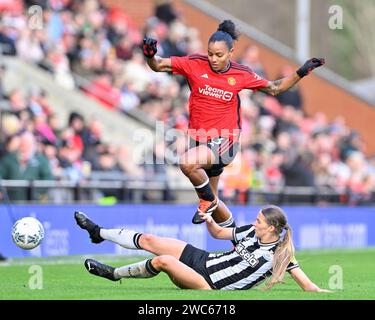 Geyse of Manchester United Women rides as Newcastle slide tackle, during the Vitality Women's FA Cup match Manchester United Women vs Newcastle United women at Leigh Sports Village, Leigh, United Kingdom, 14th January 2024  (Photo by Cody Froggatt/News Images) Stock Photo