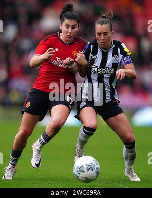 Manchester United's Lucia Garcia (left) and Newcastle United's Amber-Keegan Stobbs during the Adobe Women's FA Cup fourth round match at the Leigh Sports Village Stadium, Manchester. Picture date: Sunday January 14, 2024. Stock Photo