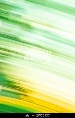 Green art blurred bokeh sparks flying background with motion effect. Green abstract flowing light trails effect. Green dynamic curving light trails. Stock Photo