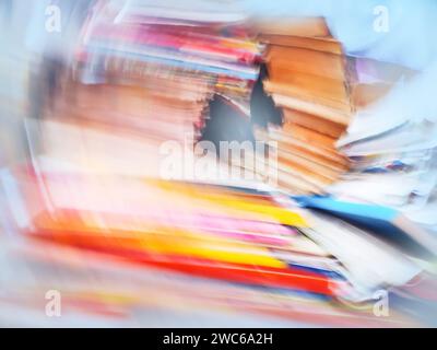 Old books in the library blurred texture. Bookshelf shop defocused blurry effect background. Stock Photo