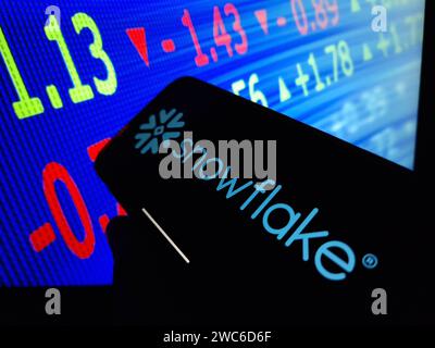 Konskie, Poland - January 13, 2024: Snowflake company logo displayed on mobile phone screen Stock Photo
