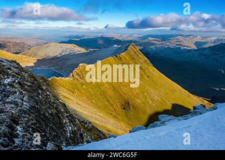 Striding Edge on Helvellyn in the Lake District National Park with a light covering of winter snow Stock Photo