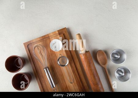 kitchen utensils on light background, seen from above. Stock Photo