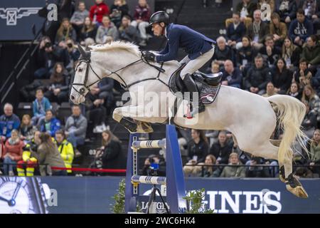 Germany s Hans Dieter Dreher rides Elysium during the jump off in