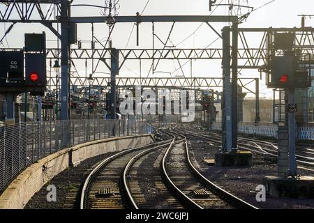 Railway tracks and overhead gantry signals at red on the appraoch to Glasgow Central Railway station, Glasgow, Scotland, UK Stock Photo