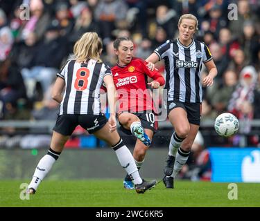 Leigh Sports Village, Manchester, UK. 14th Jan, 2024. Womens FA Cup Football, Manchester United versus Newcastle Ladies; Katie Zelem of Manchester United Women crosses the ball past Kelly of Newcastle Credit: Action Plus Sports Images/Alamy Live News Credit: Action Plus Sports/Alamy Live News Stock Photo