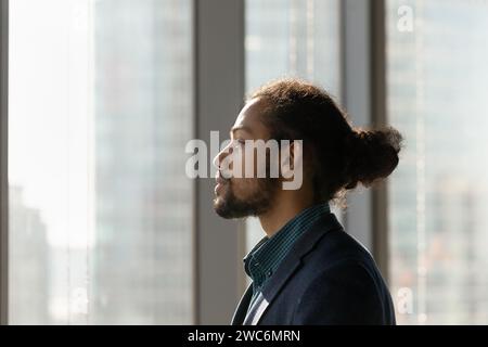 Young biracial male worker in formal suit plan successful career Stock Photo