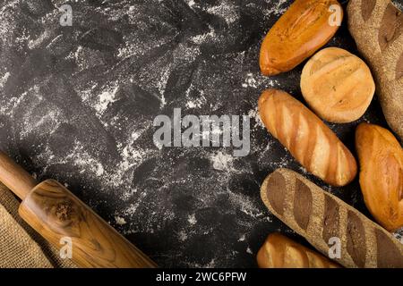 Bakery. Different types of fresh bread on the table. Stock Photo