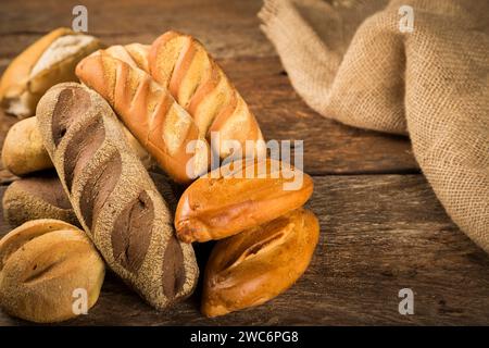 Bakery. Different types of fresh bread on the table. Stock Photo