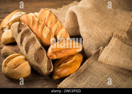 Bakery. Different types of fresh bread on the table. Stock Photo