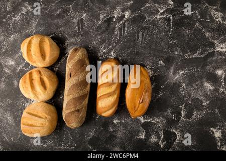 Bakery. Different types of fresh bread on the table. Stock Photo