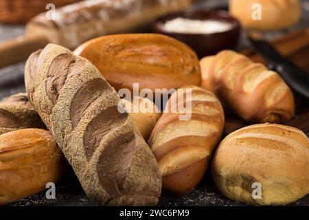 Bakery. Different types of fresh bread on the table. Stock Photo