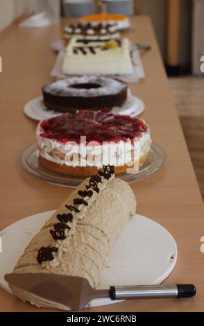 One with various cakes, festively set up dinner table Stock Photo
