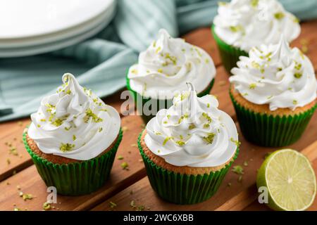 Tasty cupcakes with lemon on a wooden table. Stock Photo