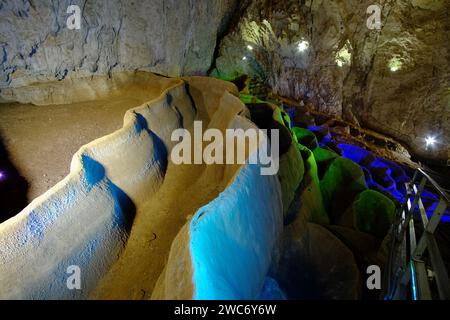 cave formation, undulating rimstone-pools inside illuminated Stopica Cave, Rozanstvo, Serbia Stock Photo