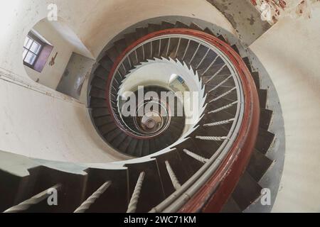 Spiral staircase inside an ancient lighthouse in Denmark Stock Photo