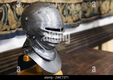 Medieval knight closed iron helmet close-up photo with selective soft focus Stock Photo