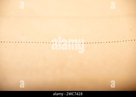 An up-close view capturing intricate handwritten notes on a wooden table surface Stock Photo