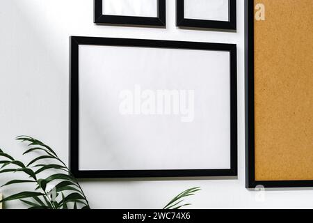 Set of black frames on white wall with copy space Stock Photo