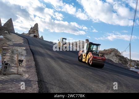 Asphalt Roller Compactor Power Paver Roller paving road in Goreme Cappadocia Turkey Turkiye Stock Photo