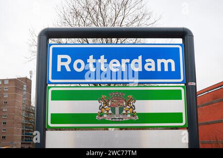 Rotterdam, Netherlands - January 12, 2024: Place name sign and coat of arms of the city of Rotterdam. Stock Photo