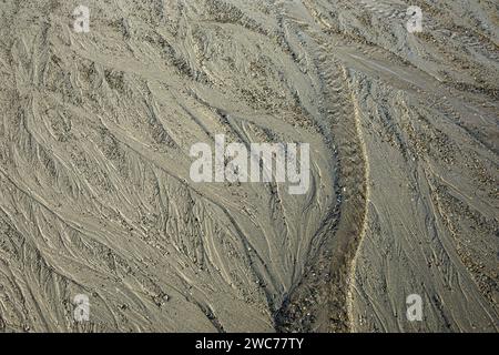 WA25007-00...WASHINGTON - Lines and patterns created on Ruby Beach by water and the out going tide in Olympic National Park. Stock Photo