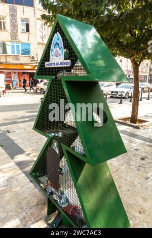 Waste container ina an artistic form of a fir tree installation. Eco container for used plastic bottles disposal, Sunliurfa Turkey Stock Photo