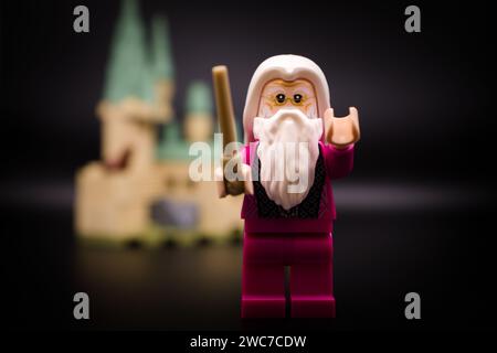 Dumbledore in front of Hogwarts Castle. Lego minifigure and all other bricks are made by THE LEGO GROUP Stock Photo