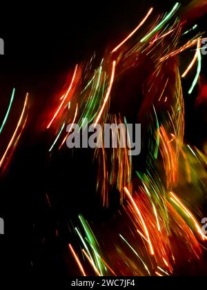 Night view blurred texture with neon light. Boke colorful bright neon rays for party background Stock Photo