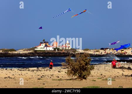 Colourful, large kites at La Concha beach, and the Dream House designed by architect and artist Antonio Padrón Barrera . Taken November 2023 Stock Photo