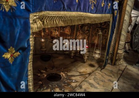 The birthplace of Jesus Christ, a Christian shrine, in the Church of the Nativity in Bethlehem City, West Bank, Palestine. Stock Photo