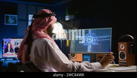 System administrator in personal office running programming scripts on computer, solving tasks. Skilled programmer manipulating lines of code for artificial intelligence applications development Stock Photo
